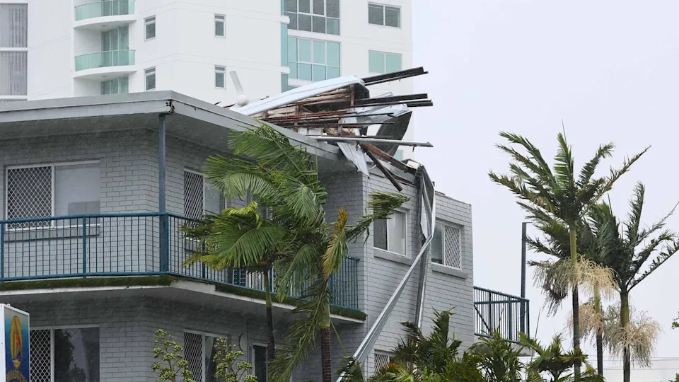 Australian Yahoo News Source: A coastal apartment building in northern Queensland shows severe roof damage after repeated storm surges and strong winds in 2025.